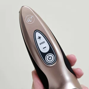 A first-hand picture of Mumsnet editor Rebecca's hand holding the Womanizer Pro40 against a wall