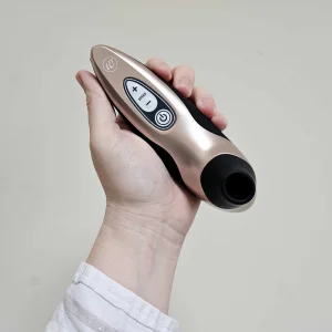 A first-hand picture of Mumsnet editor Rebecca's hand holding the Womanizer Pro40 against a wall
