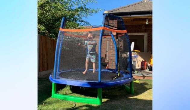 a child bouncing on the costway 7ft toddler trampoline