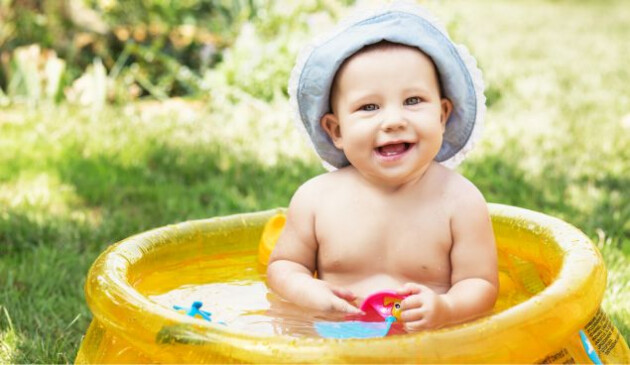 a baby in a small paddling pool