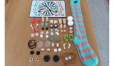 A pair of stripey Sock Game socks, game board and 60 game pieces