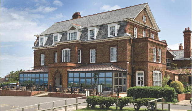 a large hotel with two big conservatories