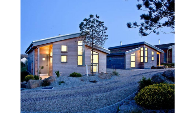 modern holiday lodges at dusk