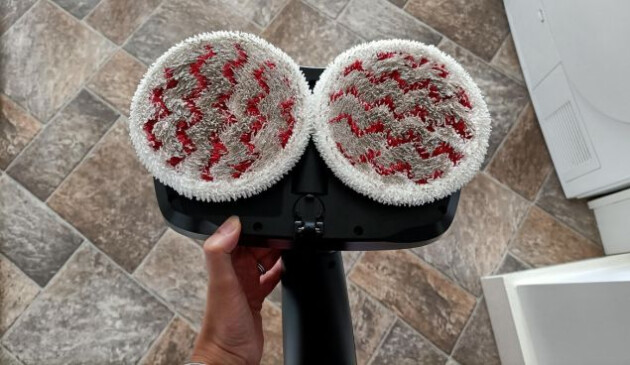 The underside of the Vileda Looper floorhead, showing two microfibre cleaning pads covered in dirt
