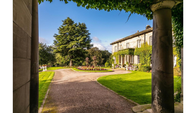 the drive leading up to a stately home
