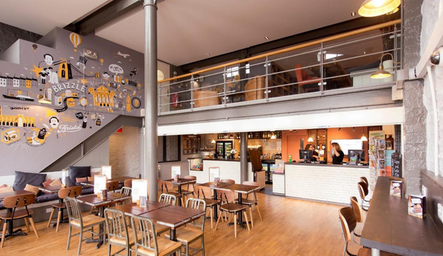 a modern cafe with a mezzanine level