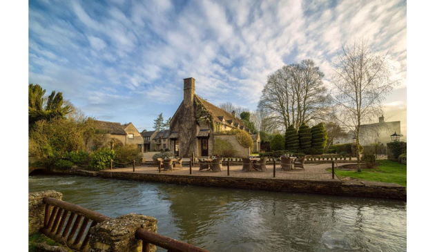 a riverside hotel on a sunny day
