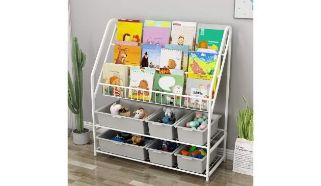 A bookcase. Three layers of books. Then, below, there is two levels of plastic buckets containing other items.