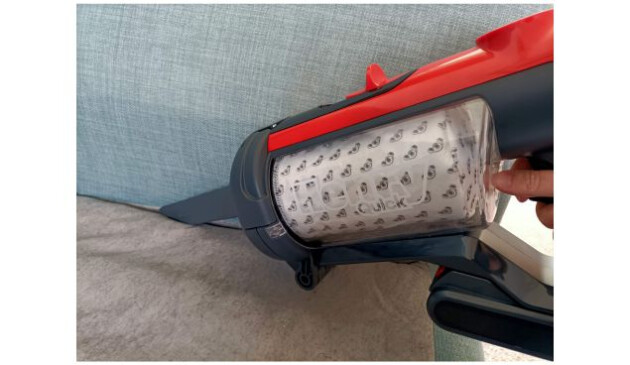 Henry Quick with the 2-in-1 combi tool being used to hoover down the side of the sofa