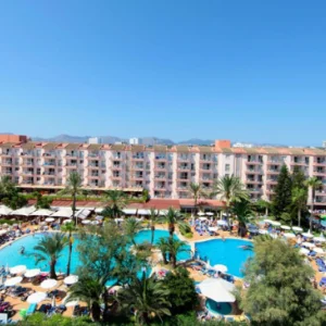 a view of a hotel in Mallorca with pools and balconies