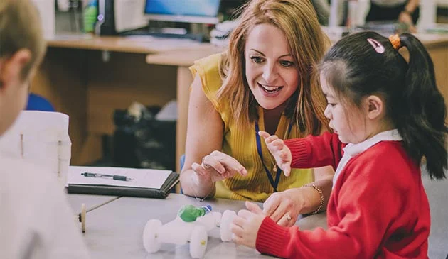 Teacher and child in a primary school