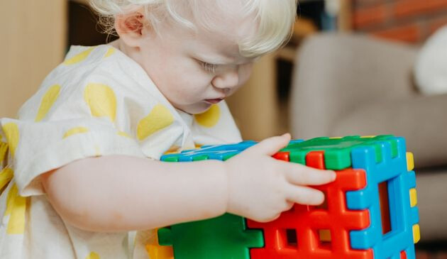 Baby holding toy