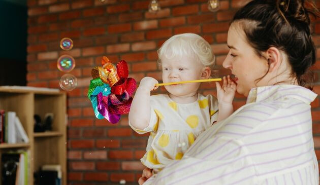 Baby looking at bubbles