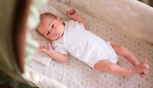 baby lying in a crib