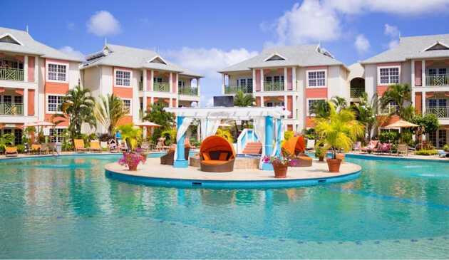 Bay Gardens' pool and hotel exterior