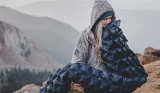 Woman blowing up air bed