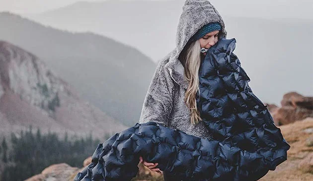 Woman blowing up air bed