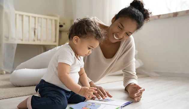 Mum reading with baby