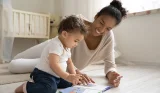Mum reading with baby