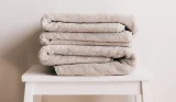 pile of bath towels on a table
