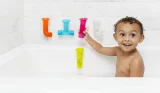 Toddler playing in the bath