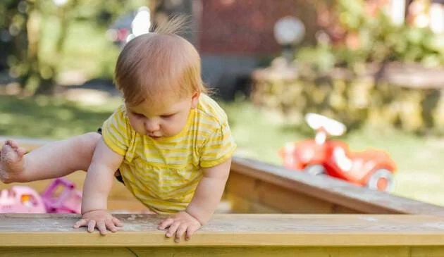 Child playing in sandpit