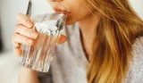 Woman drinking a glass of water