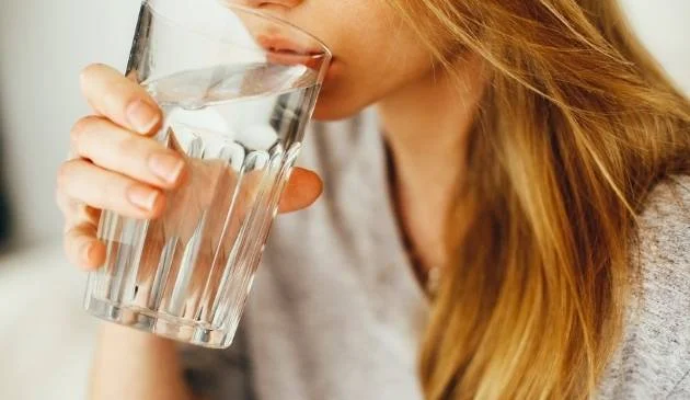 Woman drinking a glass of water