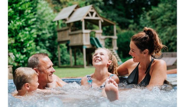 a family in a hot tub