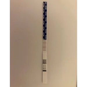 Boots pregnancy test strip after use showing positive result