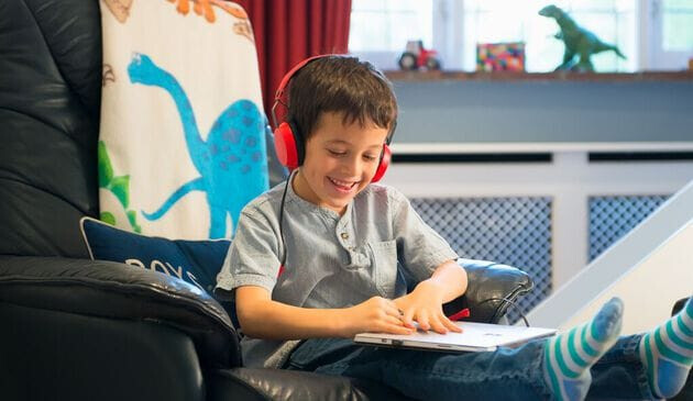 Boy playing on tablet