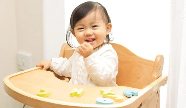 Child eating in highchair