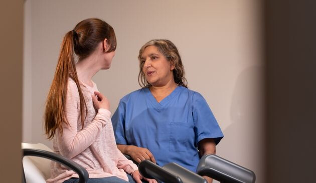 Woman talking to doctor