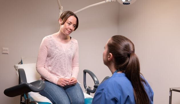 Woman talking to doctor