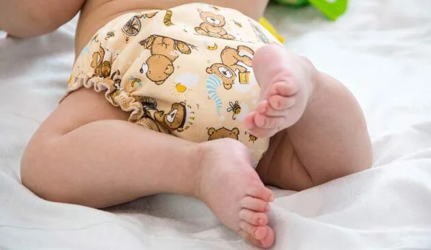 baby in cloth nappy