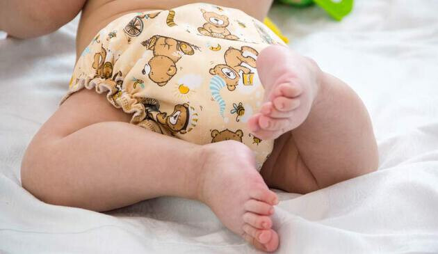 baby in cloth nappy