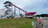A dad and two kids walking around Combe Haven holiday park