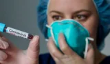 medical researcher with syringe