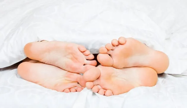 Feet in bed