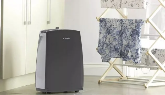 a dehumidifier drying clothes
