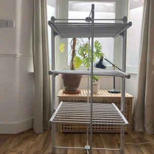 Journalist Rachel Erdos hand testing the Dry:Soon Three Tier Heated Airer