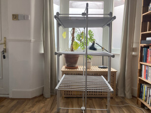 Journalist Rachel Erdos hand testing the Dry:Soon Three Tier Heated Airer