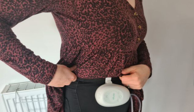 Elvie Stride hub attached to woman's trouser band
