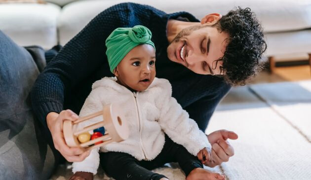 Father with baby and shaker