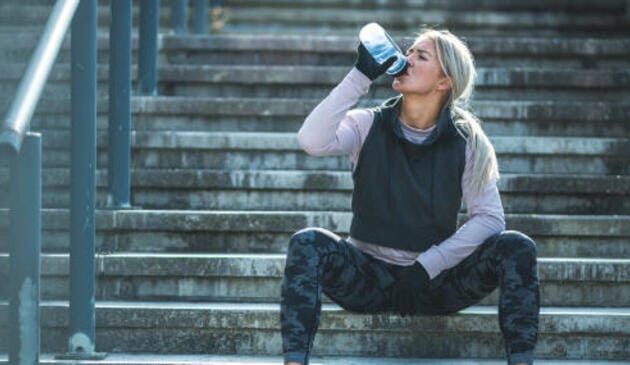 Female runner taking a drink