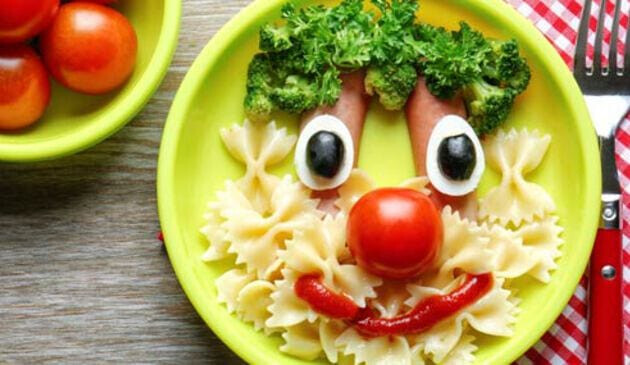 Face made from pasta and vegetables