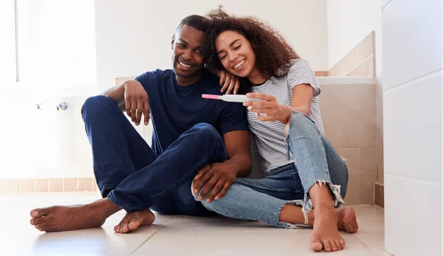 Couple checking pregnancy test