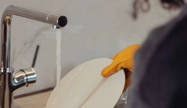 Woman hand washing pots