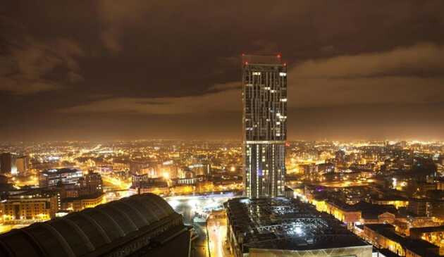 Hilton Deansgate and Manchester at night