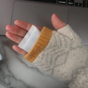 Hot Hands Instant Hand Warmers in a pair of fingerless gloves